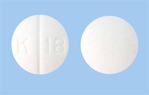C 230. . White round pill k 18